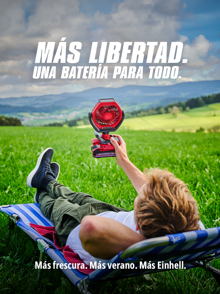 Imagen de un hombre tumbado en la hierba con un abanico en la mano y, a la izquierda, el texto. "MÁS LIBERTAD. UNA BATERÁ PARA TODO. Más frescura. Más verano. Más Einhell."